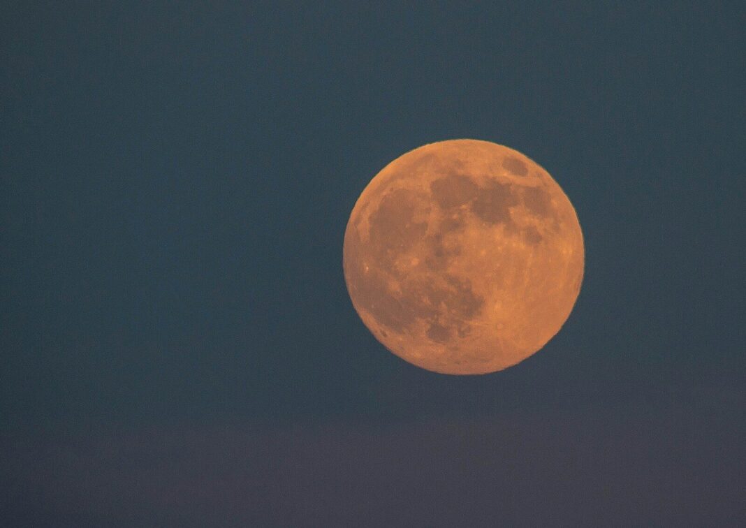 full moon in dark night sky